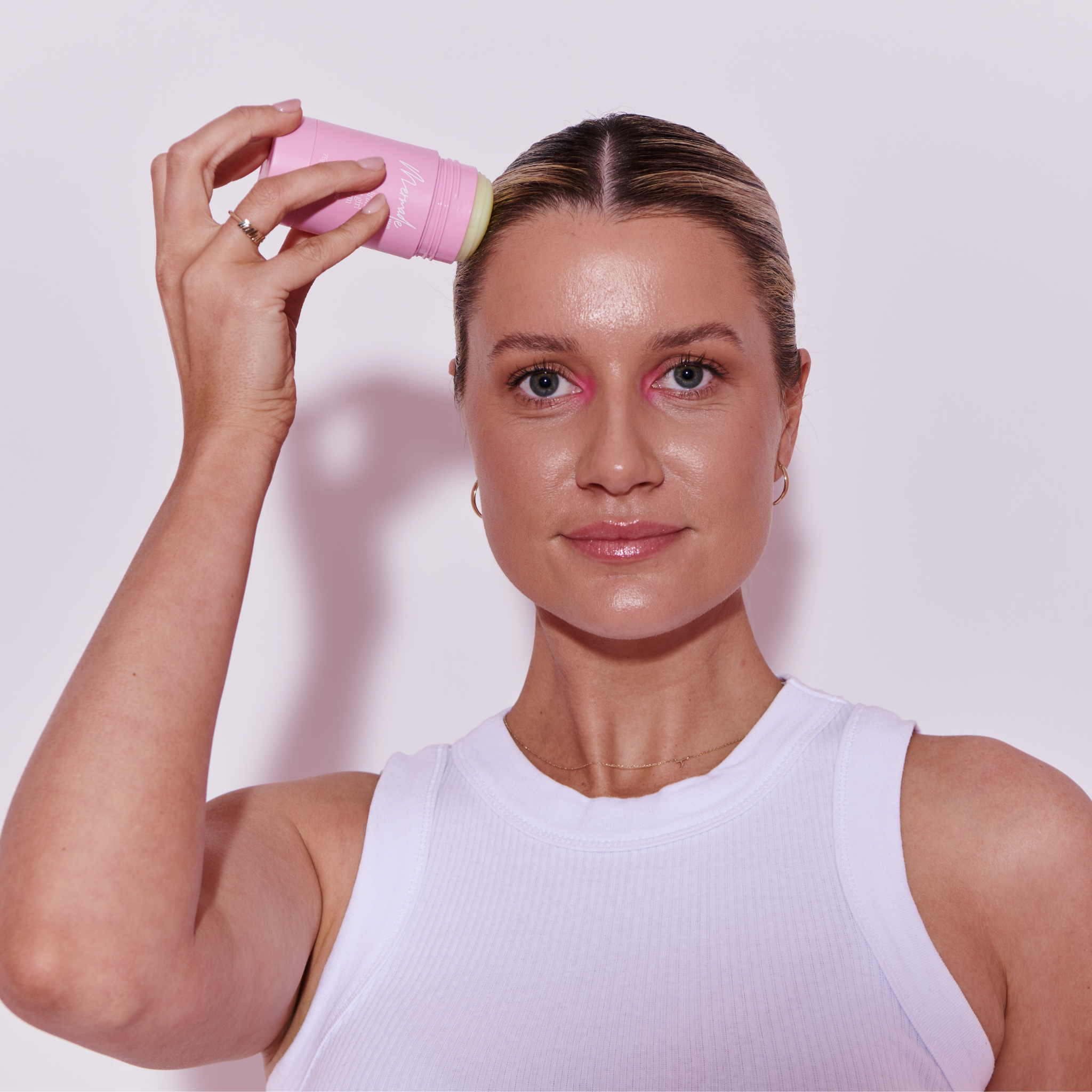 Model using the Mermade Hair Hair Styling Wax Stick