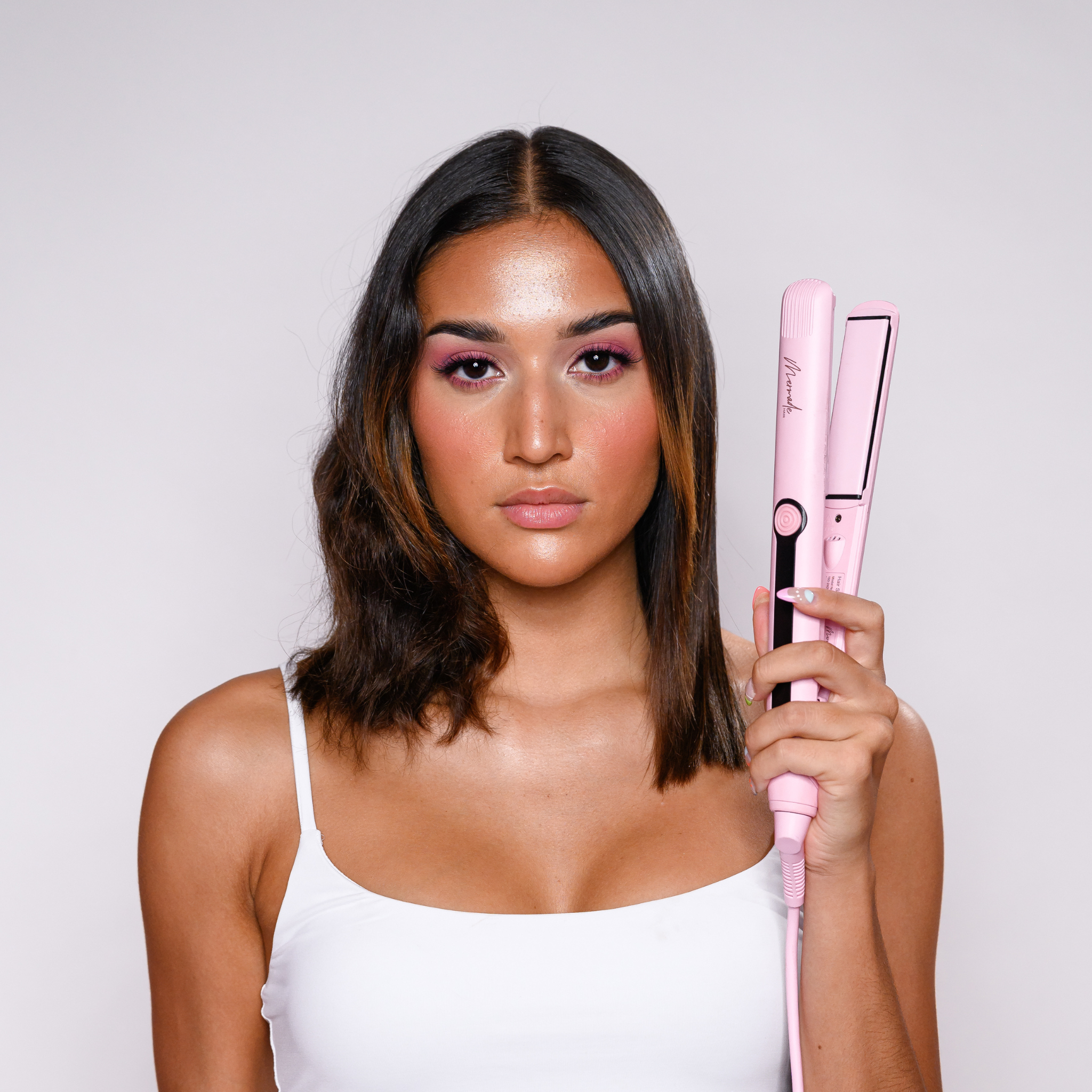 before and after of the Mermade Hair Pink Straightener