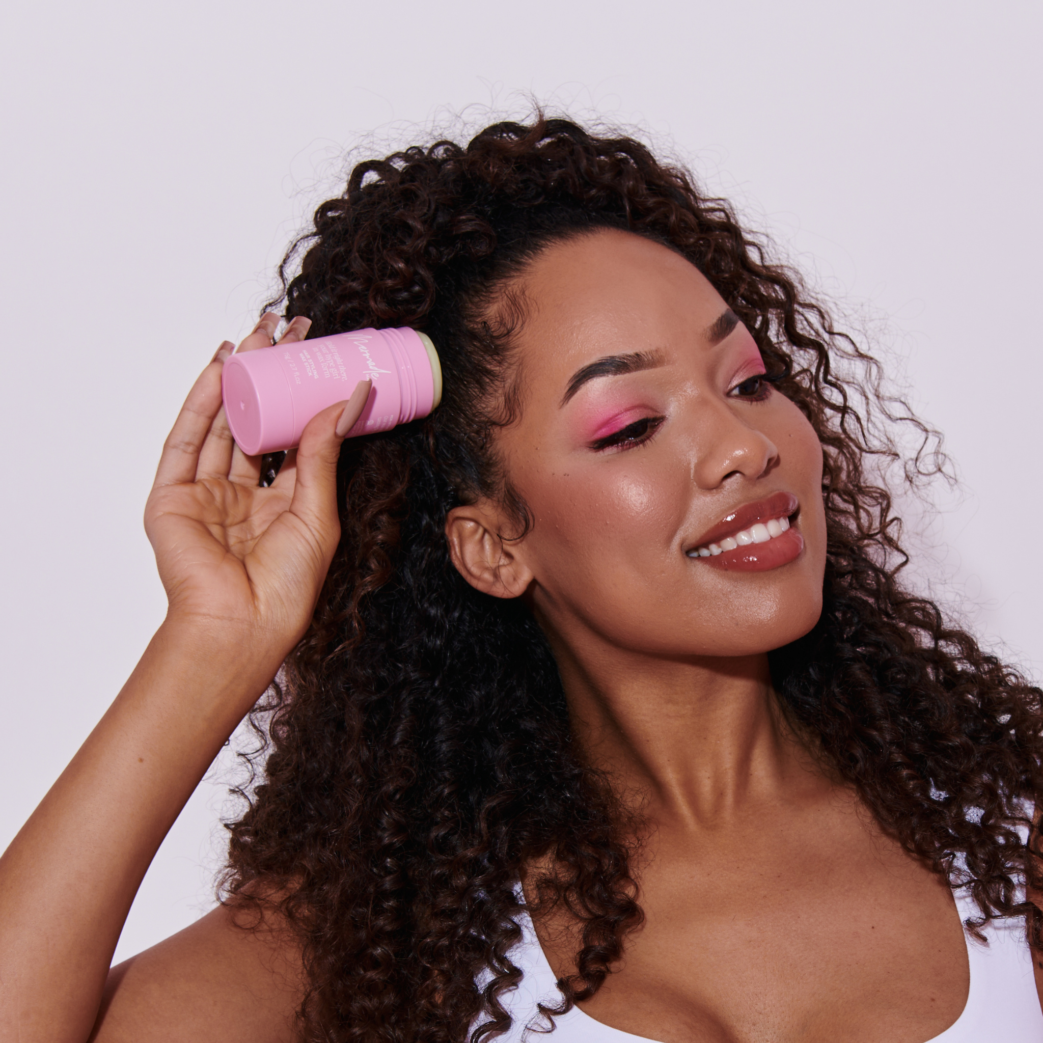 Model using the Mermade Hair Hair Styling Wax Stick