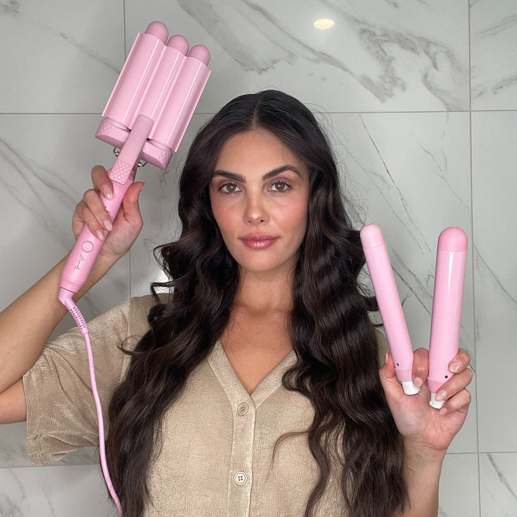 Model using the Mermade Hair Pink Style Wand